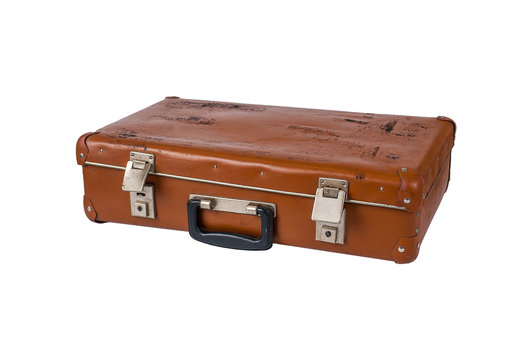 Ancient brown suitcase on a white background isolated