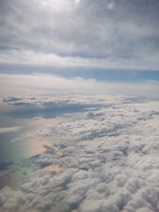 Scenic view of sky and sea from an airplane at sunset time