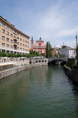 Fototapeta na wymiar Franciscan Church of the Annunciation and Triple Bridge on the Ljubljanica River in Ljubljana, Slovenia 