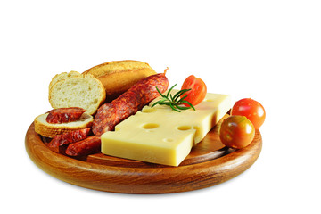 Emmental cheese and chorizo pork sausage on wooden board isolated.
