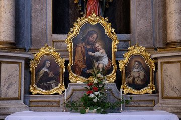 Saint Joseph holding child Jesus, painting on the altar in the St Nicholas Cathedral in Ljubljana, Slovenia