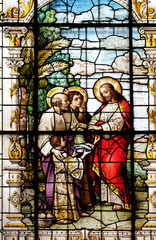 Obraz premium The Multiplication of the Loaves and Fish, stained glass window in the Basilica of the Sacred Heart of Jesus in Zagreb, Croatia