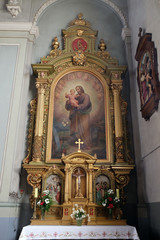 Fototapeta na wymiar Saint Joseph holding child Jesus altarpiece in the Basilica of the Sacred Heart of Jesus in Zagreb, Croatia 