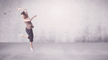Pretty urban dancer with empty background