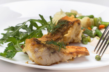 Fish dish - fried fish fillet and vegetables