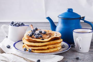 Pancake with banana , blueberries and honey.