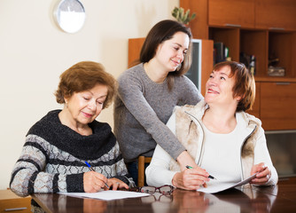 Fototapeta premium Three women with papers