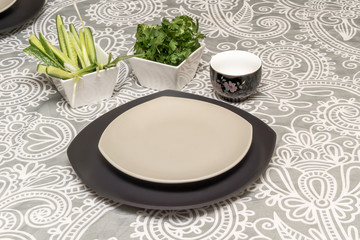 Two stacked empty plates on the table