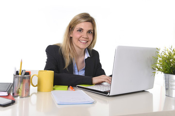 corporate portrait young happy Caucasian blond business woman working typing on laptop computer