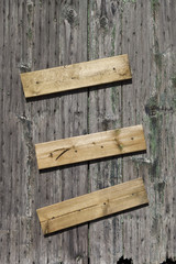Wooden wall with nailed boards