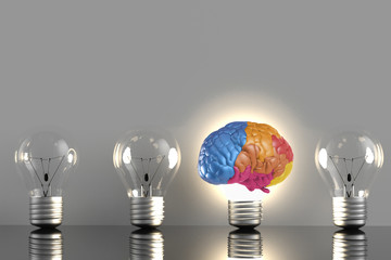 creative concept with colourful brain in idea lightbulb