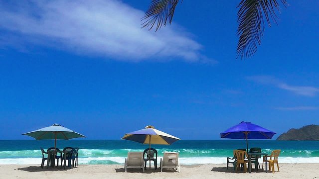 Beach chairs and umbrellas at a Caribbean exotic beach