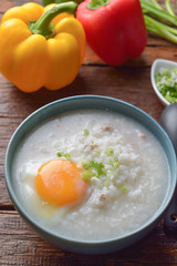 Thai chinese asian rice porridge with pork and egg  in  bowl, co