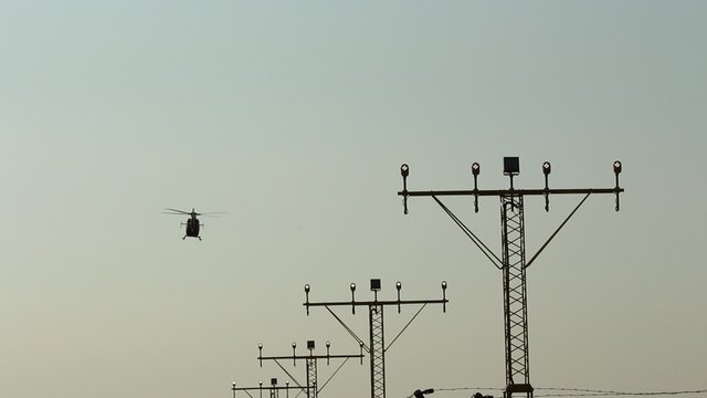 Runway lights and landing helicopter