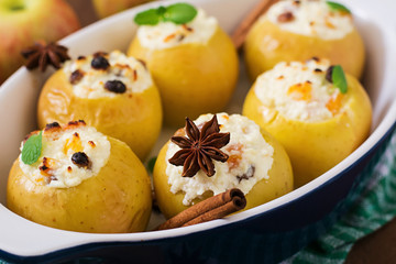 Appetizing baked apples with cottage cheese and raisins