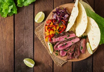  Mexican fajitas for beef steak and grilled vegetables. Top view © timolina