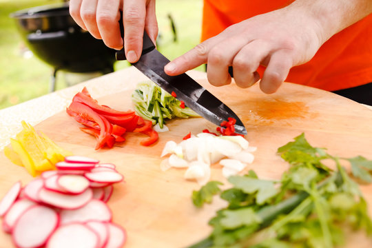 man cutting vegetables