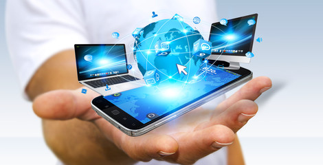 Businessman connecting tech devices