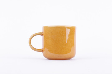 Brown coffee cup made of ceramic.