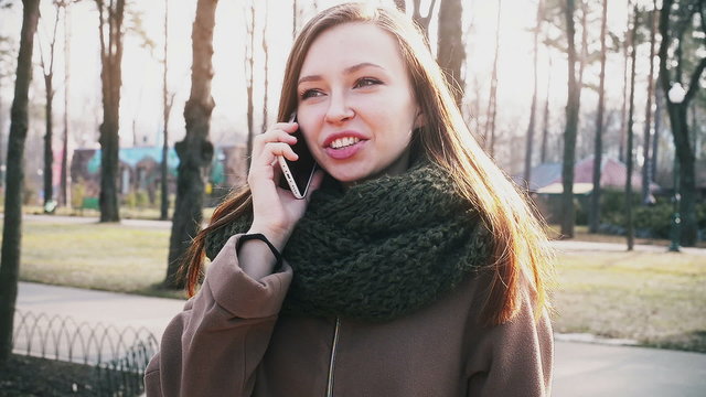 girl talking on the phone in the park
