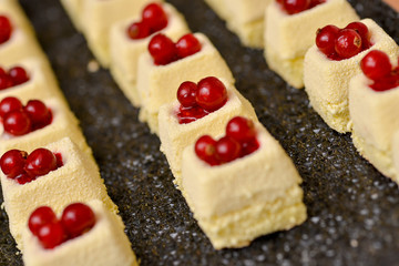 Vanilla cake with red fruits on top