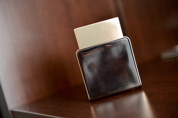 Men perfume sitting on shelf in natural light