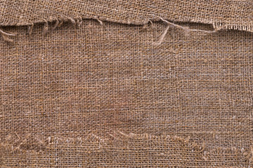 Natural burlap texture with torn edges with space for text