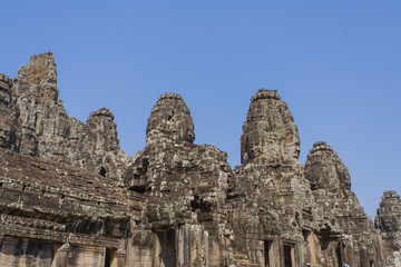 Stone head on towers of Bayon temple in Angkor Thom, Cambodia
