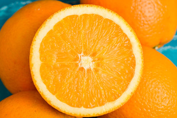 Fresh oranges on wooden blue turquoise table