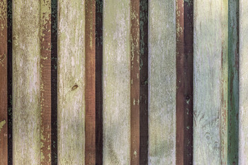 Old wood fence background with peeling paint