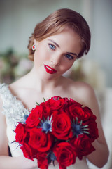 Naklejka premium Coiffure of Young Beautiful Attractive Bride with Flowers. White Dress and Wedding Decorations. Vintage Toning