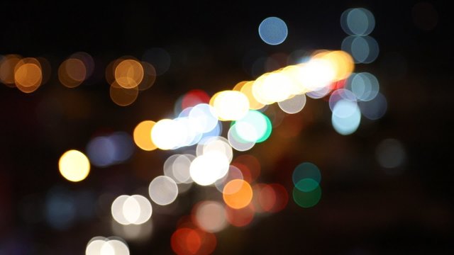 Blurry unfocused city lights. Night traffic 