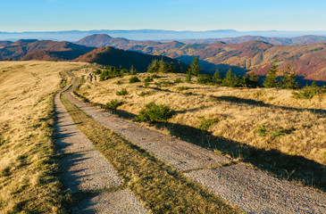 Rural road in autumn mountain.