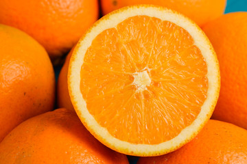 Fresh oranges on wooden blue turquoise table