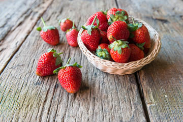 Strawberry over Wooden Background.