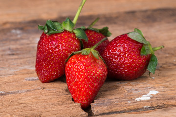 Strawberry on wooden background close up
