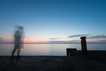 Abstract Blur silhouette of man fishing rod sunset background