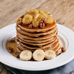 healthy breakfast of pancakes with honey, nuts and caramelized b