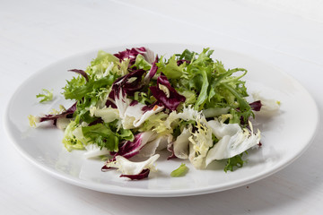 chopped lettuce on white plate
