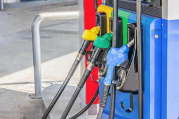 Fototapeta na wymiar Gas pump nozzles in a service station