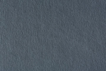 Dark gray paper texture background.