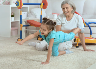 little granddaughter doing exercise