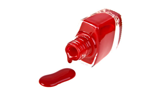 Red nail polish on a white background