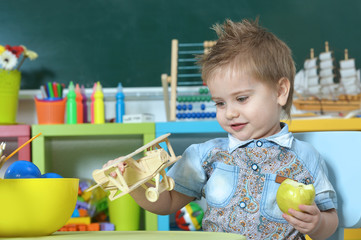 little boy playing with toy