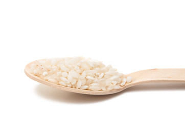 rice in a wooden spoon isolated