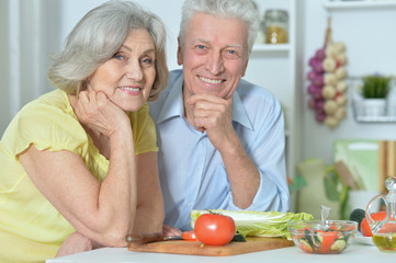 senior man and woman  in the kitchen