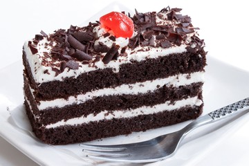 Close up of Black forest cake on white background