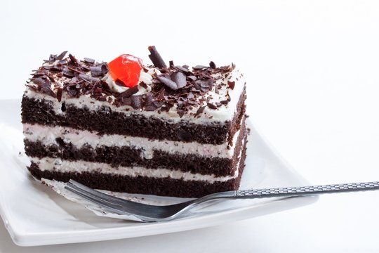 Close up of Black forest cake on white background