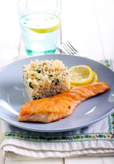 Fried piece of salmon and rice