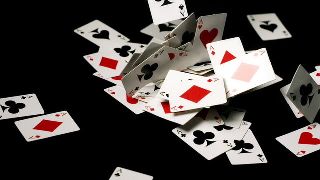 Small Playing Cards Falling in a Pile Slow Motion